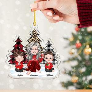 Grandma And Kids Sitting Near The Christmas Trees, Christmas Gift For Mom, Grandma, Custom Appearances And Names - Personalized Acrylic Ornament - Gift For Christmas, Family Gift